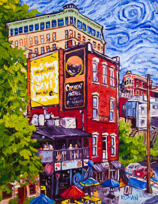 Impressionistic oil painting of a red brick building with a yellow Onyx Cave sign and a balcony cafe above colorful umbrellas, a tall cream hotel rising behind it, green trees at the sides and a swirling blue sky.